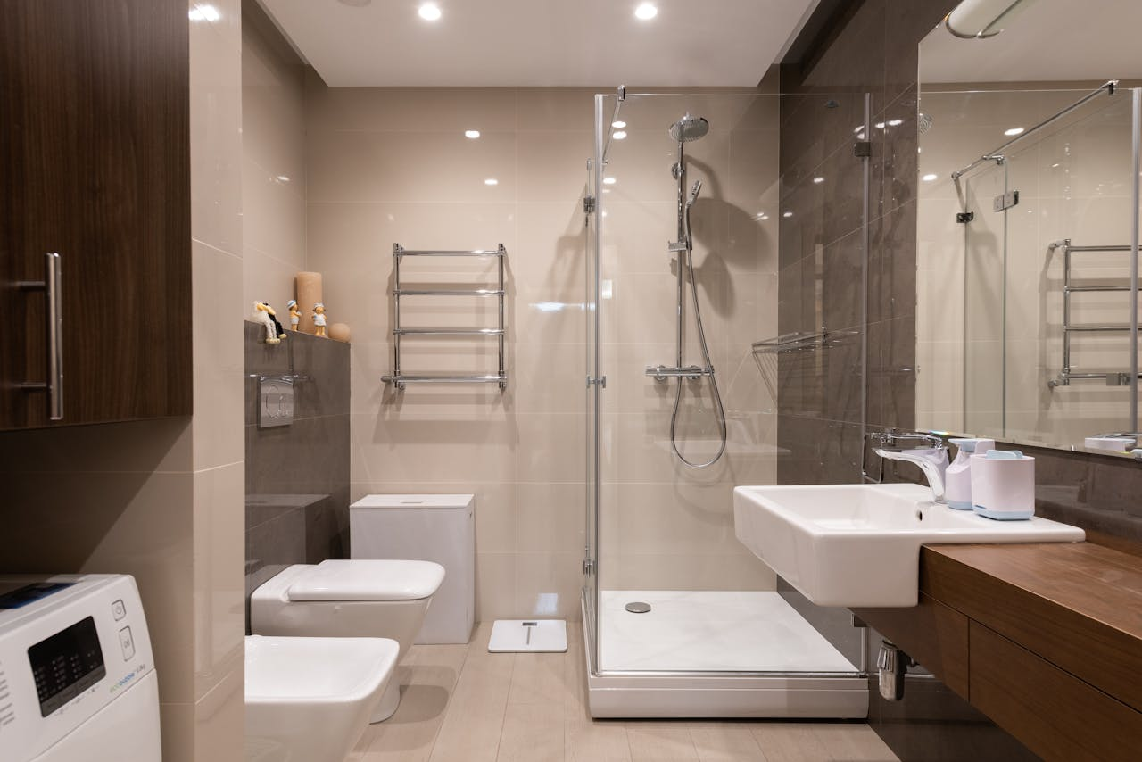 Elegant and spacious bathroom with a modern and minimalist design featuring a glass shower.